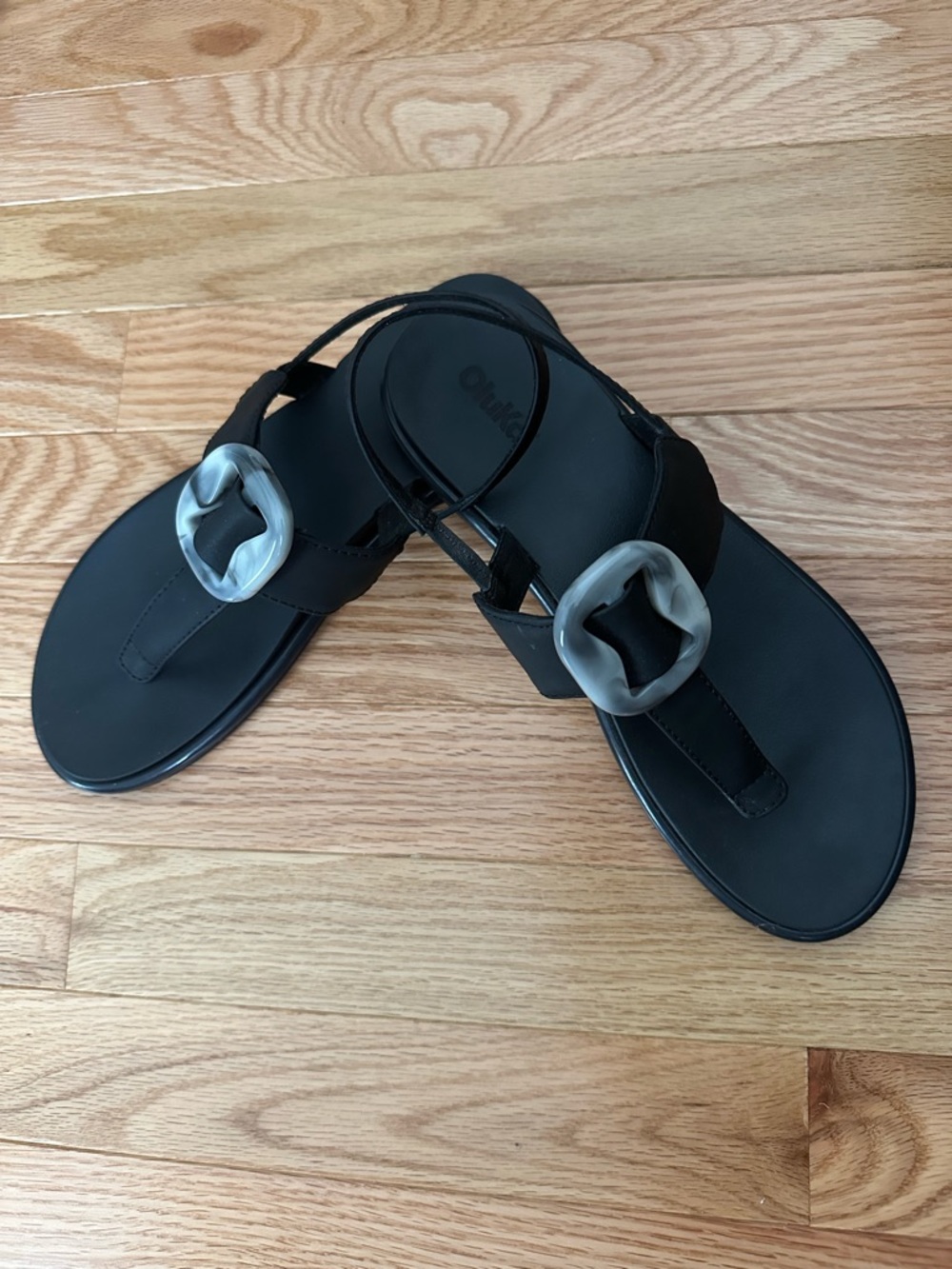 OluKai Black Toe-Post Sandals with Marbled Buckle